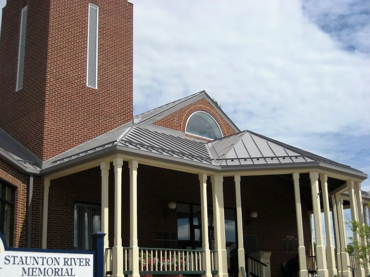 Skilled roofing craftsmen working on a residential roof in Cottleville